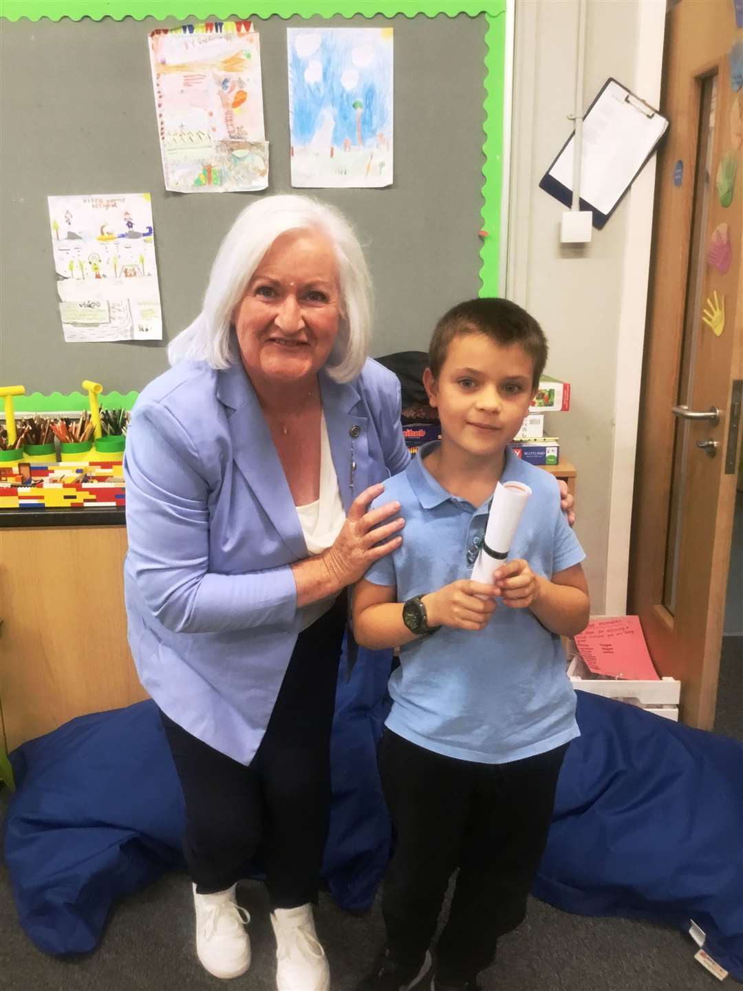 Young Lewis Mackay, who won the p1-3 class at Farr Primary School was presented with his certificate by Deputy Lieutenant Frances Gunn.