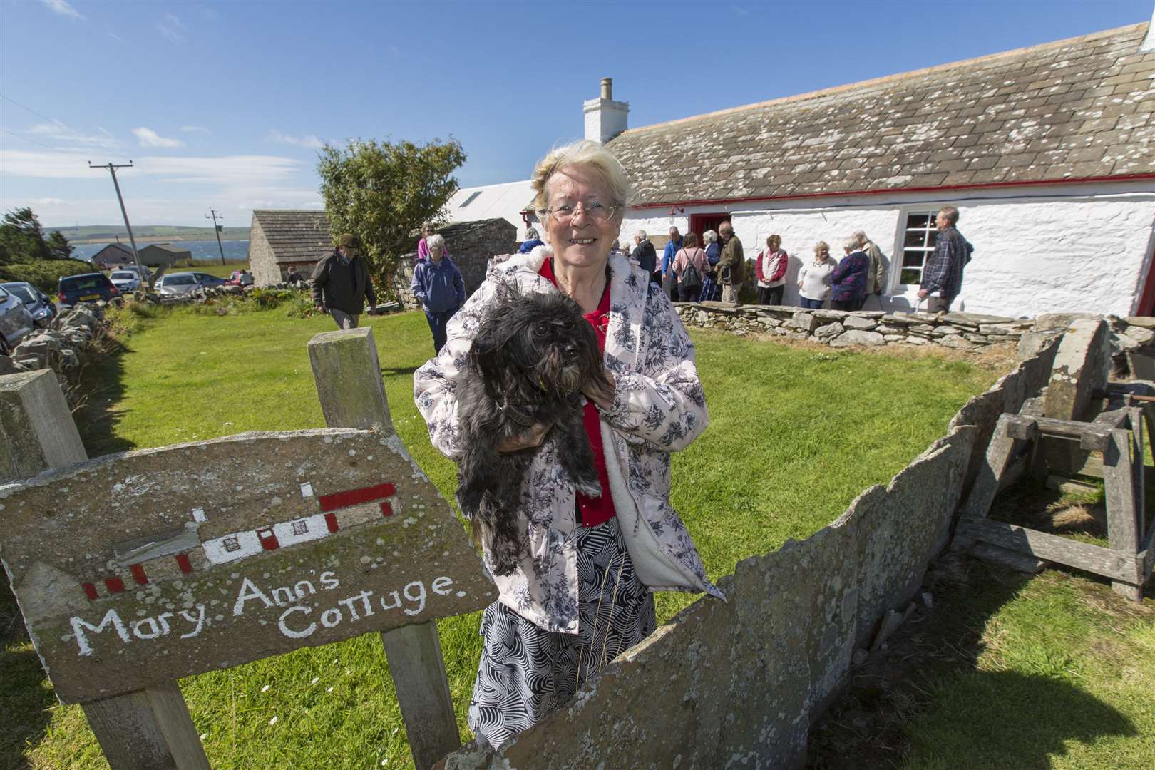 One of the farthest-travelled volunteers is Lyz Day (with her dog Laika), who lives in Switzerland. She spends six months of the year in Thurso and is one of the volunteer guides at Mary Ann's Cottage. Picture: Robert MacDonald / Northern Studios