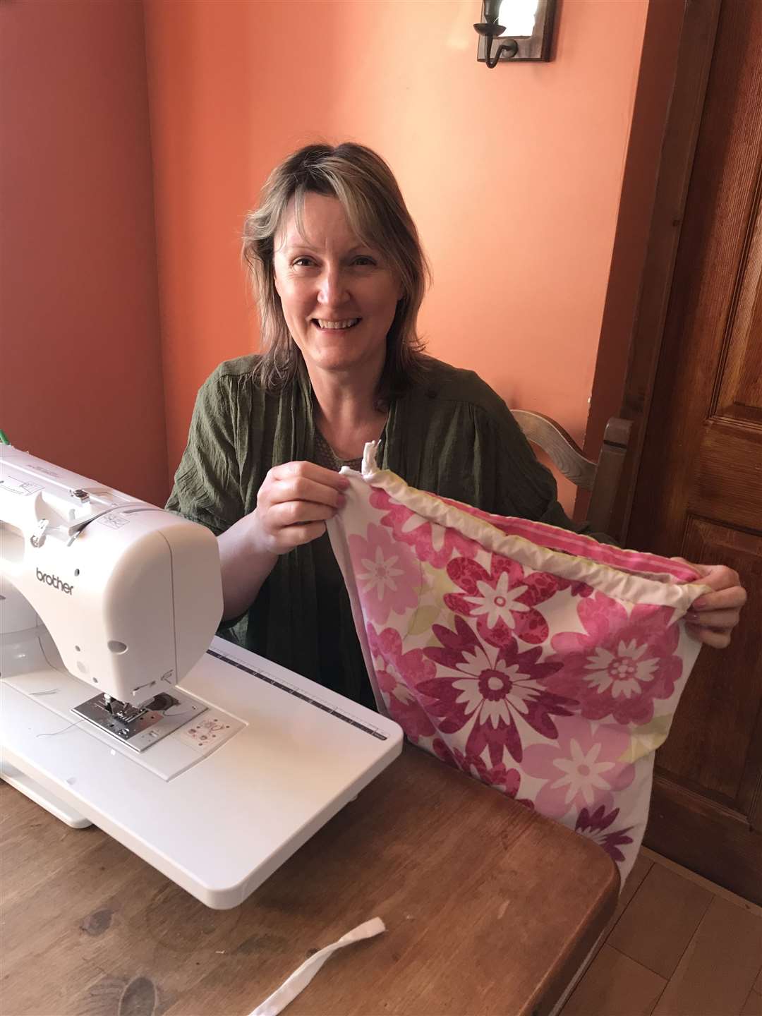 Tutor Jo Henderson sewing laundry bags earlier this year at the start of the coronavirus pandemic.