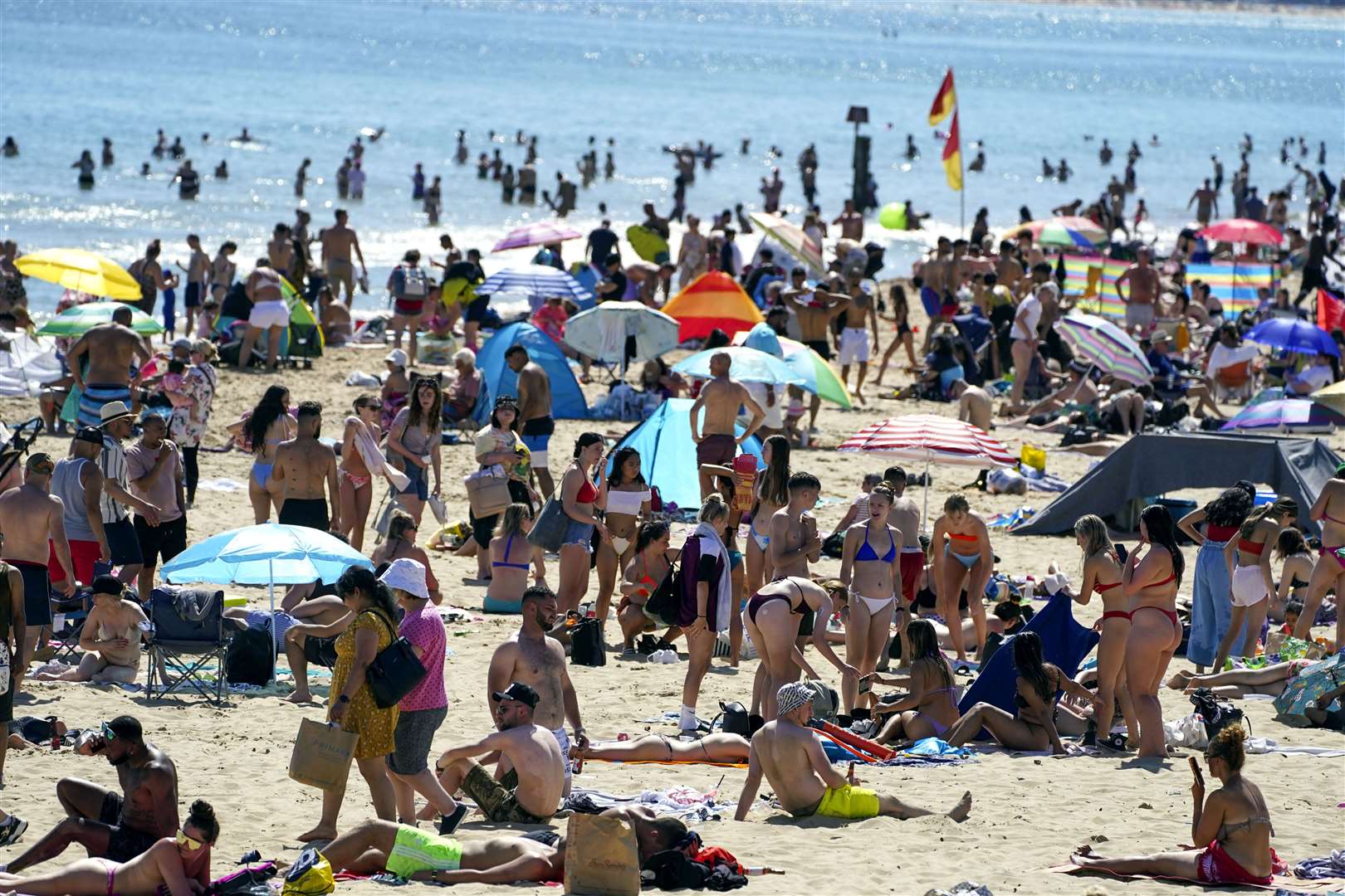 People on the beach in Bournemouth during the hot weather on June 14. (Steve Parsons/PA)