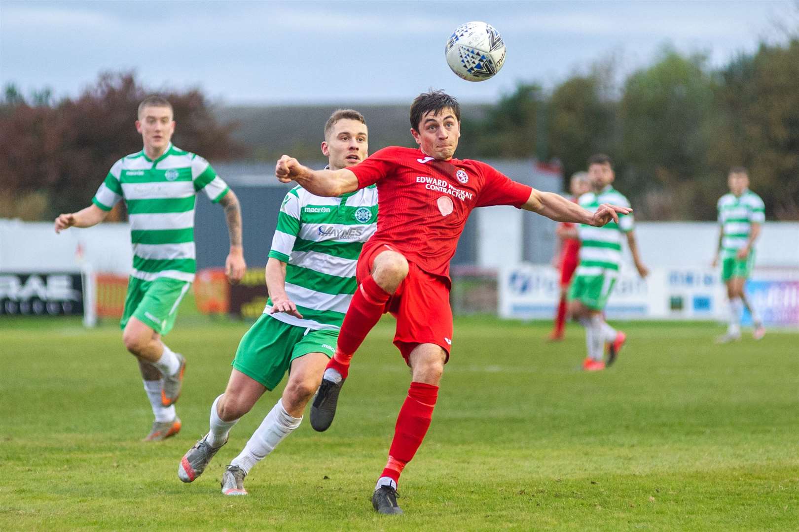 Brora Rangers' John Pickles clears the ball away from Buckie Thistle's Scott Adams. ..Brora Rangers FC (2) vs Buckie Thistle FC (2) - Buckie win 4-3 on penalties - Highland League Cup Semi Final - Dudgeon Park, Brora 18/10/2020...Picture: Daniel Forsyth..