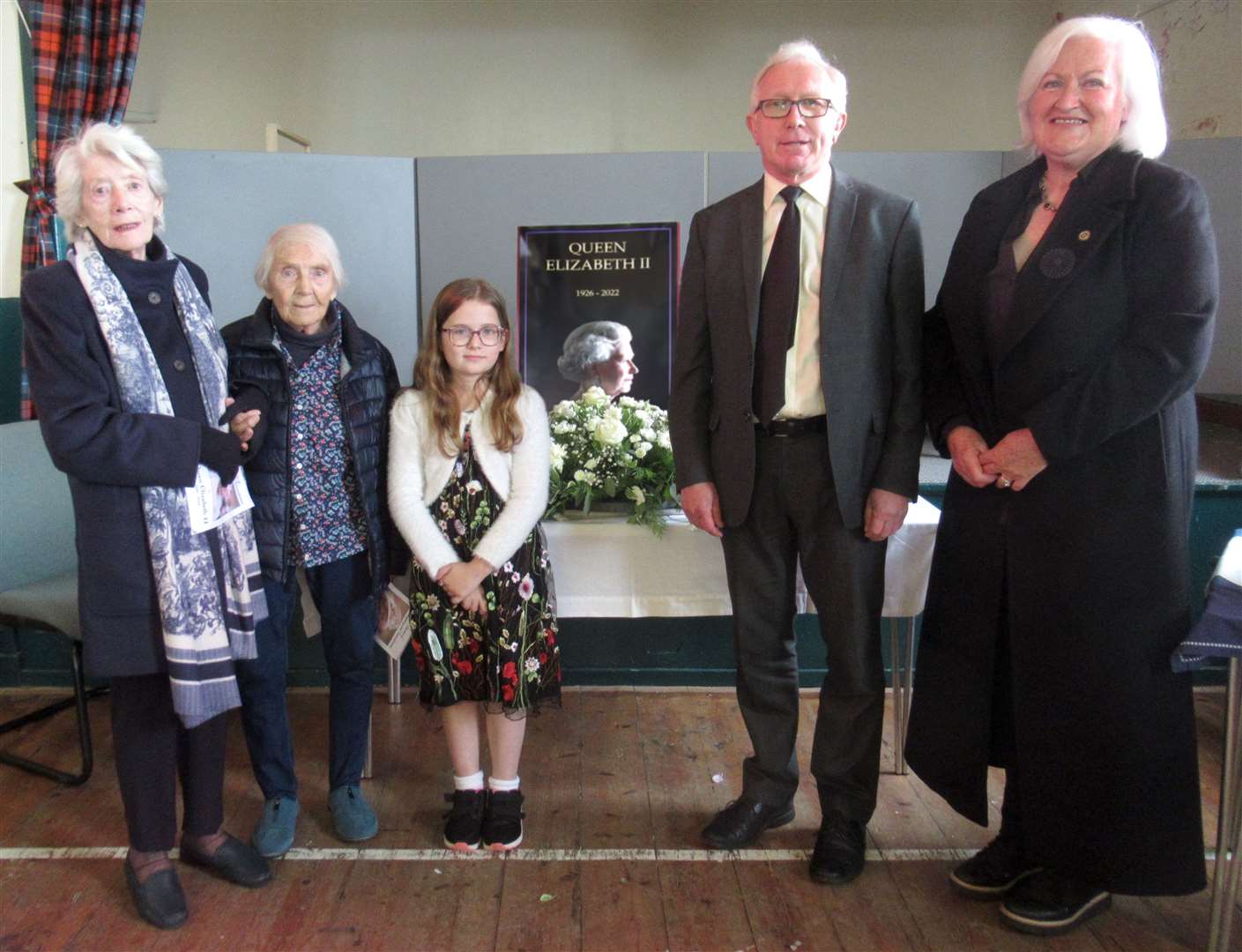 A thanksgiving service at Melness saw wreaths laid in memory of Queen Elizabeth II: From left, Joan (Nana) Gallagher, Yvette Brown, Mia Martin, Dr Robin Taylor, and Frances Gunn.