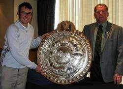 Carnegie Shield winner John Forbes (Inverness) with club captain John Gunn (right).