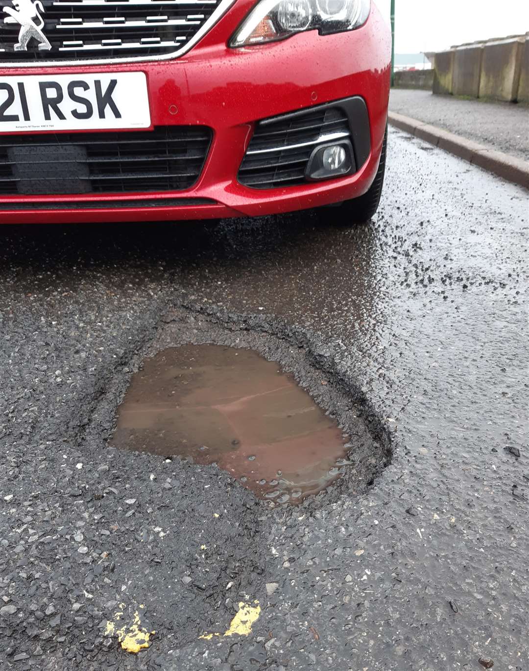 Pothole and speed bump in Riverside Road, Thurso. Picture: Matthew Reiss