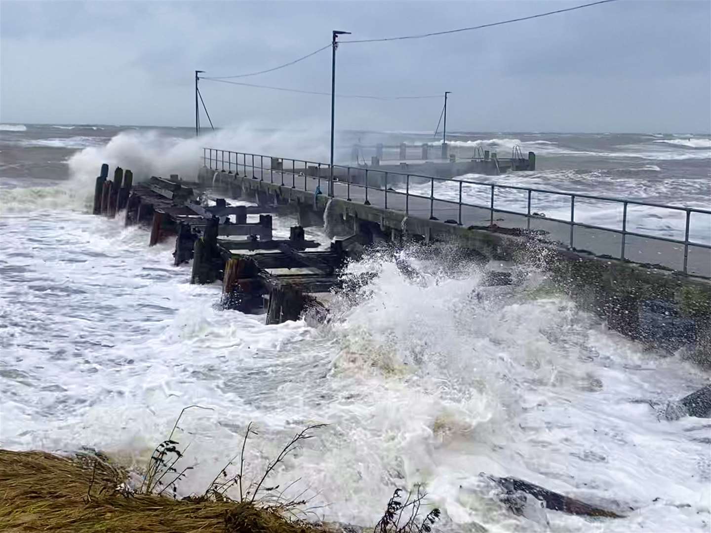 The pier at Golspie during the weekend's storm. Photographer David Richardson watched as a massive 25-foot spar from the old pier was banged about within its uprights until eventually escaping into the open sea.