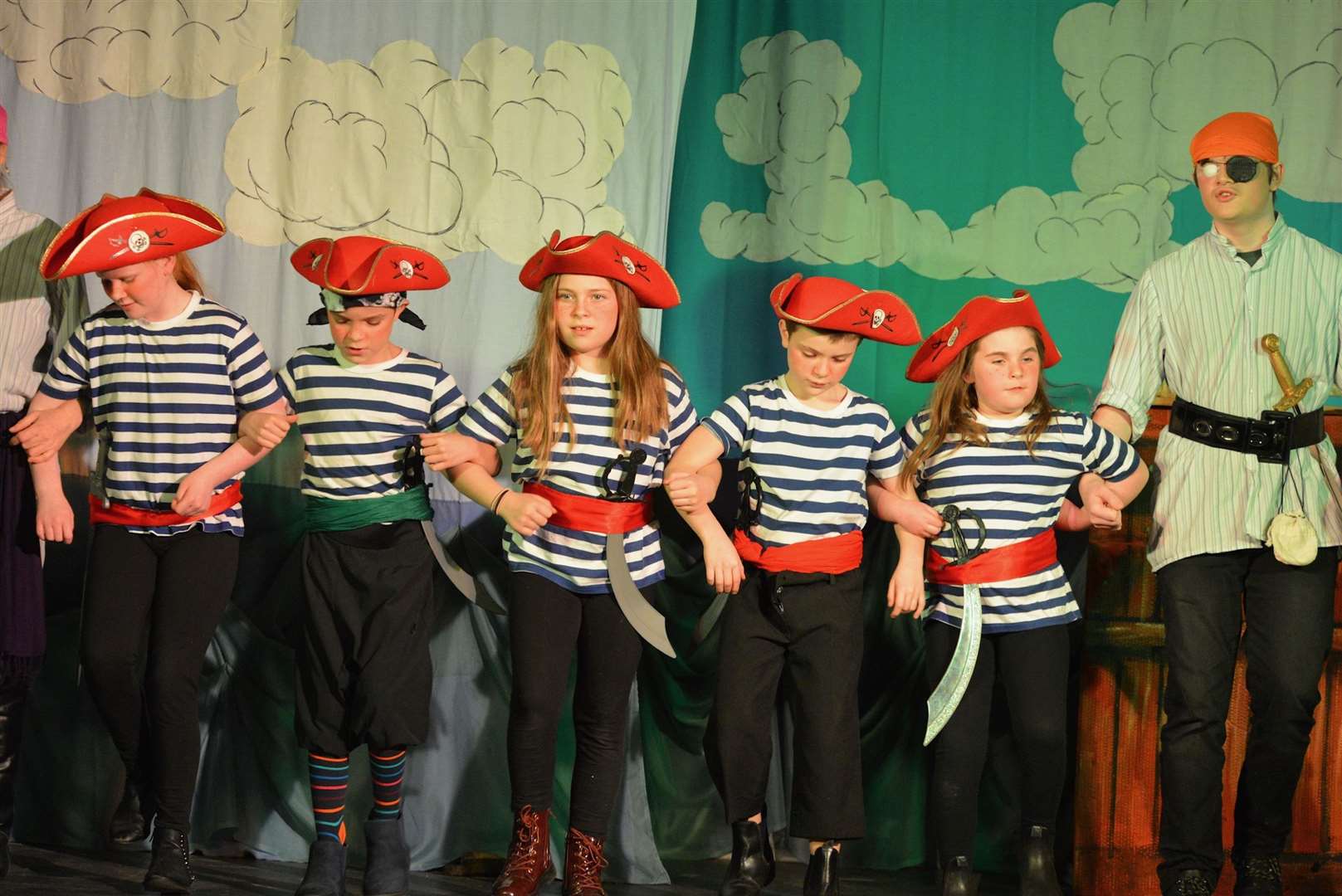 Salty Sam, Jolly Roger, Cut-Throat Kate, Jack Tar, Rascal Rose and Blind Ali dance to “You are a pirate” down on Scrabster Docks. Photo: Jim Johnston