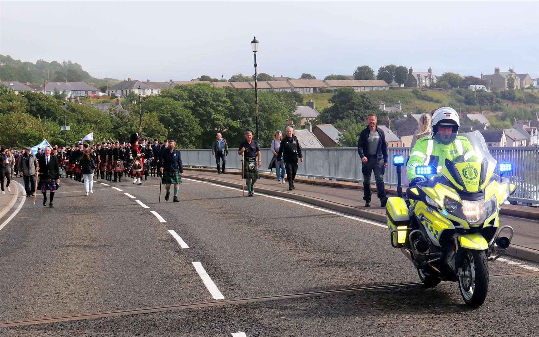 A Police Scotland motorbike escort led the parade through the village.