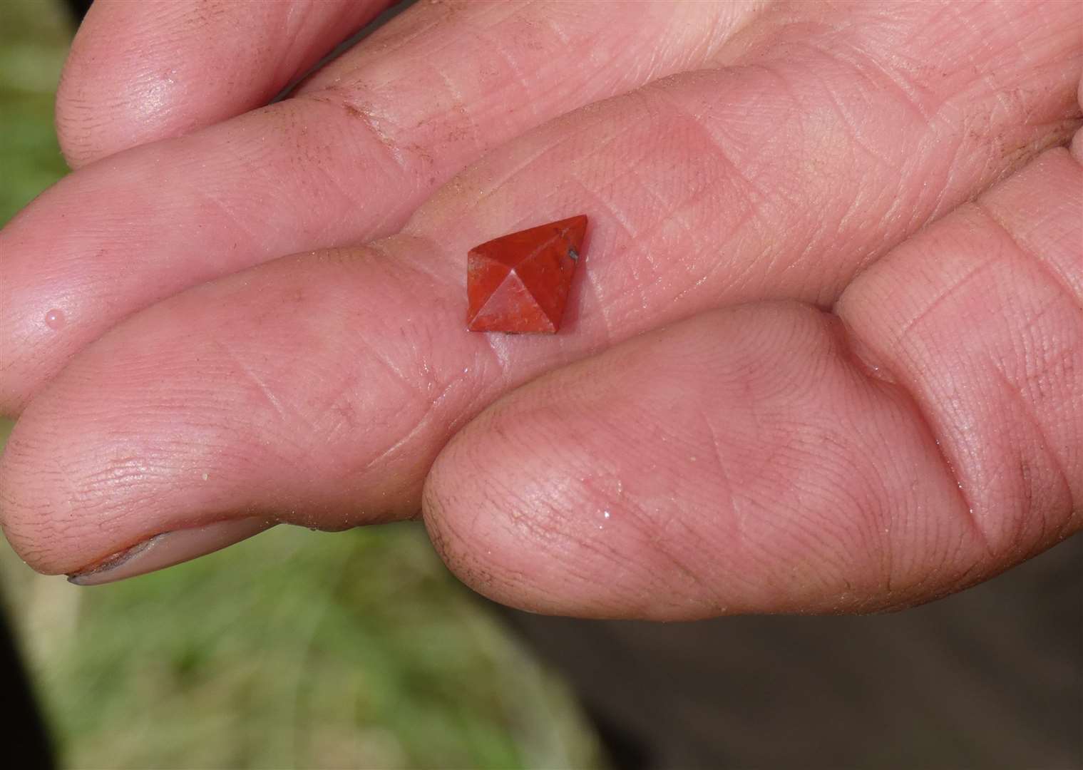 A four-faceted piece of jasper jewellery.