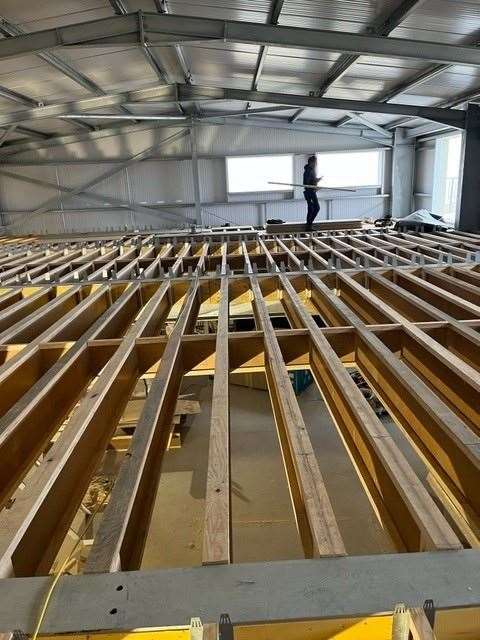An Inverness firm have donated wooden panels used in the construction of a lifeboat centre in Dornoch.