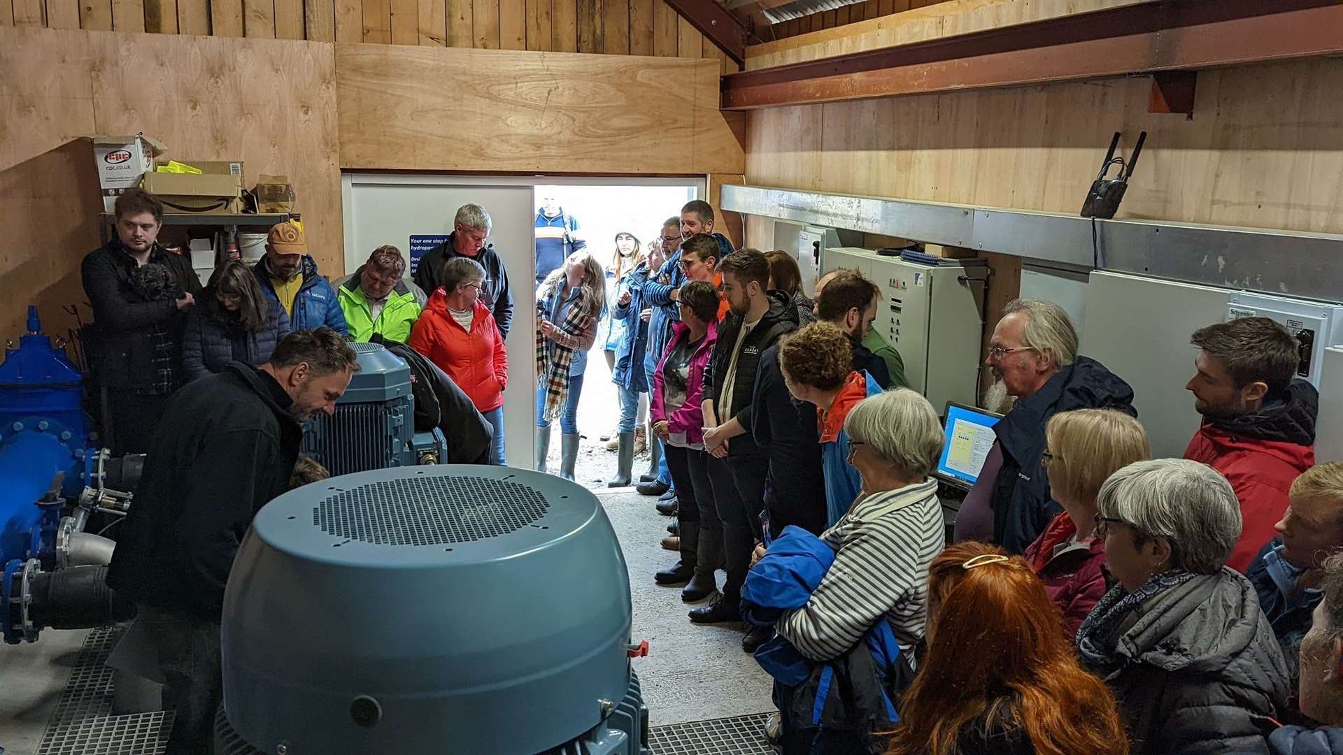 Local community in the turbine ball of the new micor hydro scheme which became operational in September last year. Photo: Raasay Community Renewables