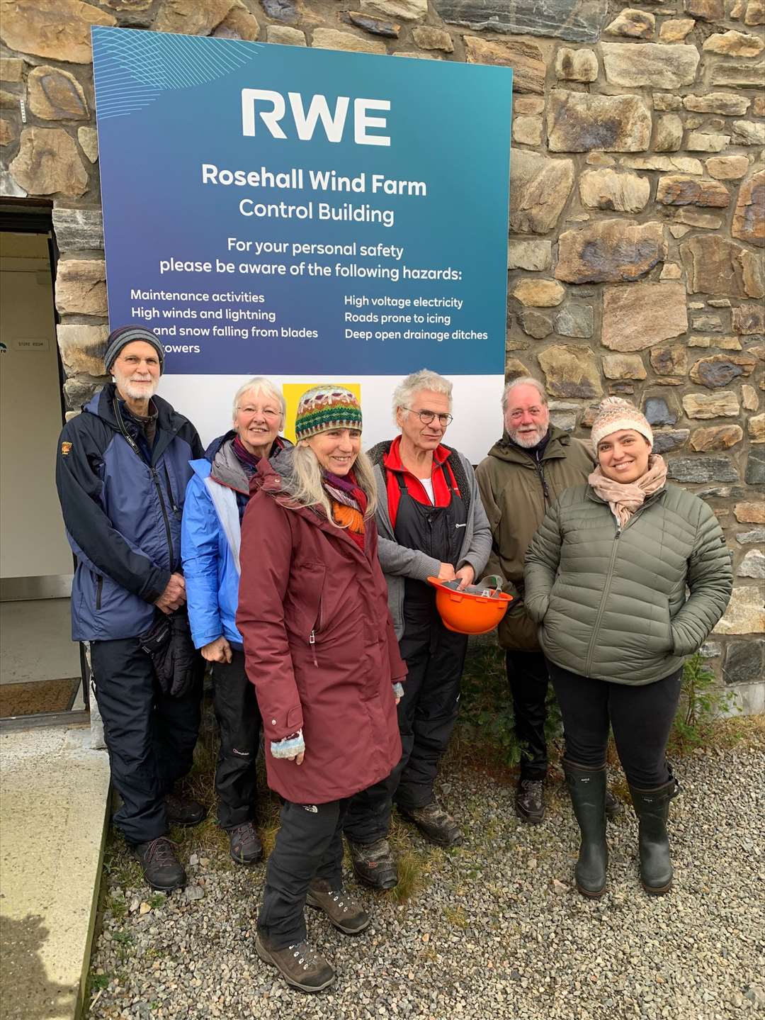 Panel members at the entrance to the control building at Rosehall Wind Farm. From left, Phil Olsen, Marion Turner, Betty Wright, Andy Wright, David Hannah and Silvia Muras Sanmartin.