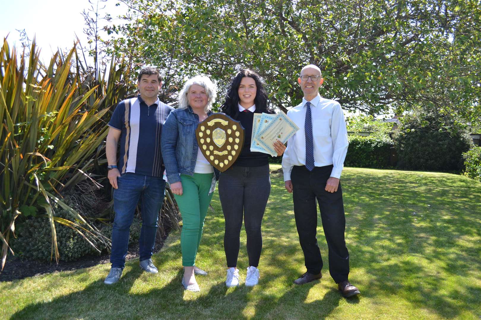 Lorna MacRae, winner of the Jessie Gordon Award, with her parents Roddy and Marina MacRae, and head teacher Mark Evans.