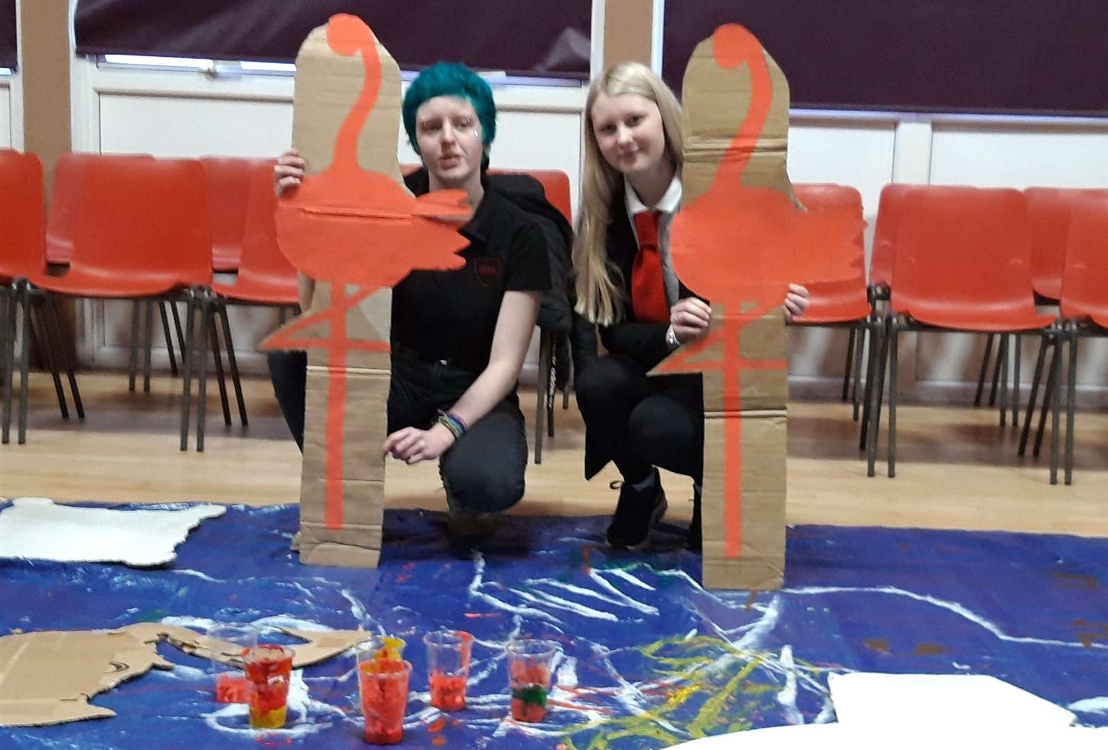 Making cardboard flamingoes for the croquet scene are Ally Oglesby (left), and Chelsi Mowat, both Golspie.