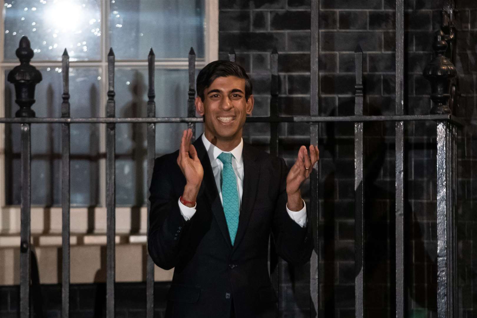 Chancellor Rishi Sunak outside 10 Downing Street, London, joining in with a national applause for the NHS. Photo credit should read: Aaron Chown/PA Wire