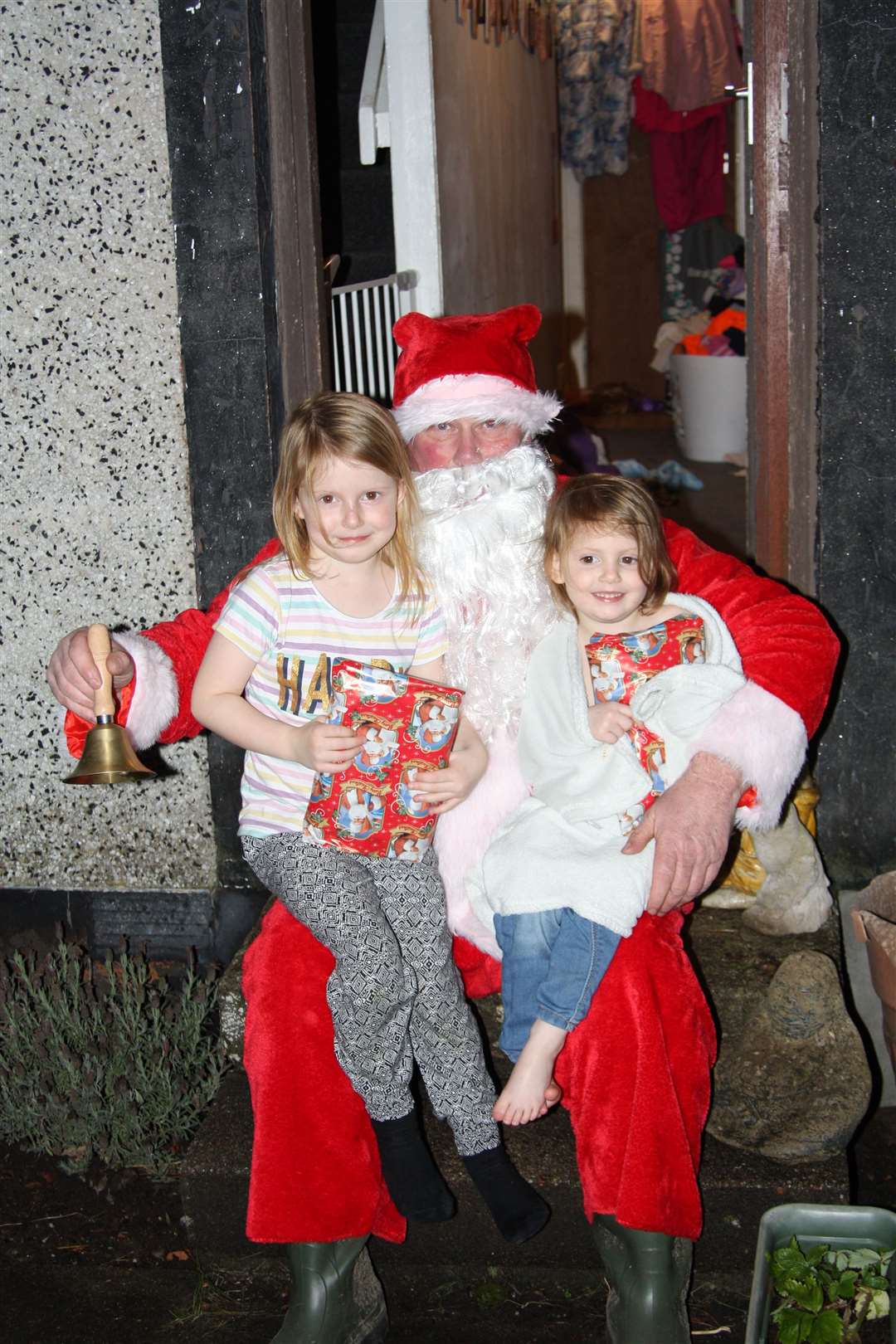 Ting-a-ling - Santa announced his presence with his hand bell. Young Elsie and Maggie Mcnicol were thrilled to receive gifts from Santa.