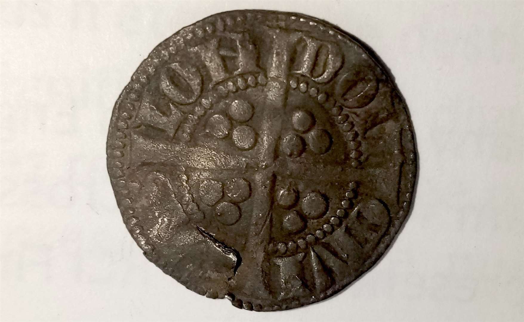 The silver penny dates from time of Edward I, also known as Edward Longshanks and the Hammer of the Scots.