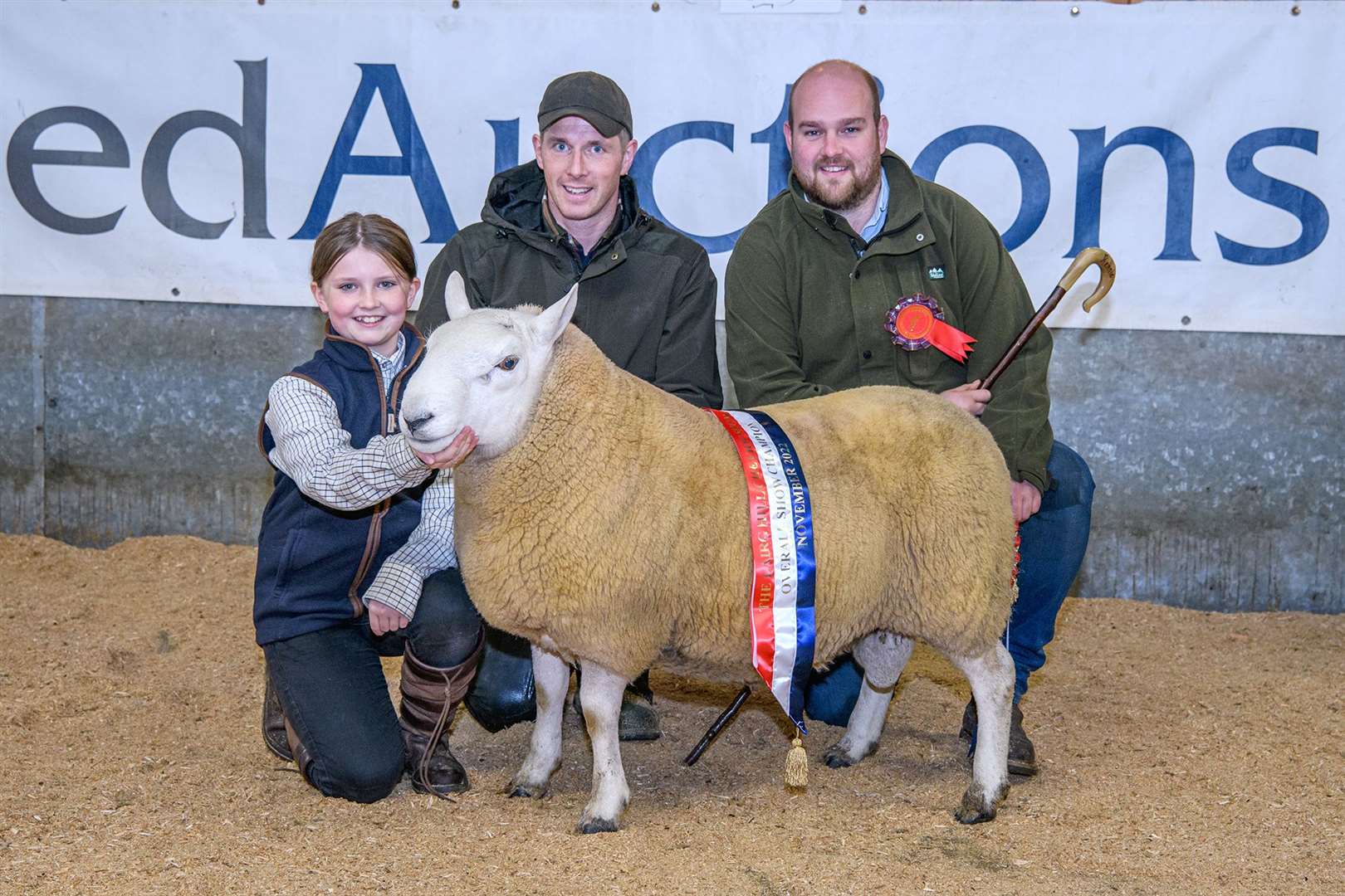 Champion was a trimmed shearling from Martin Cook, Dorrery, seen with his daughter Ava Cook and judge Bob Rennie. Picture: Angus Mackay