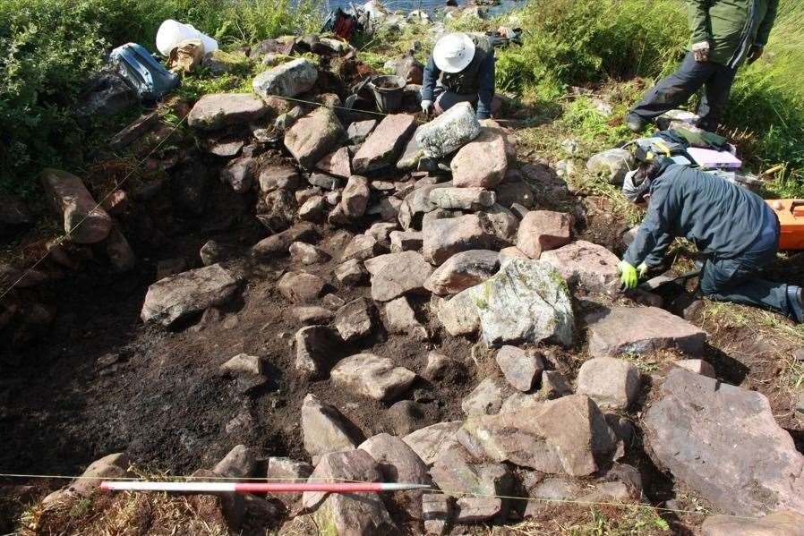 Excavations underway on the artificial islet settlement in Loch na Claise, with Historic Assynt. Photo: AOC Archaeology Group