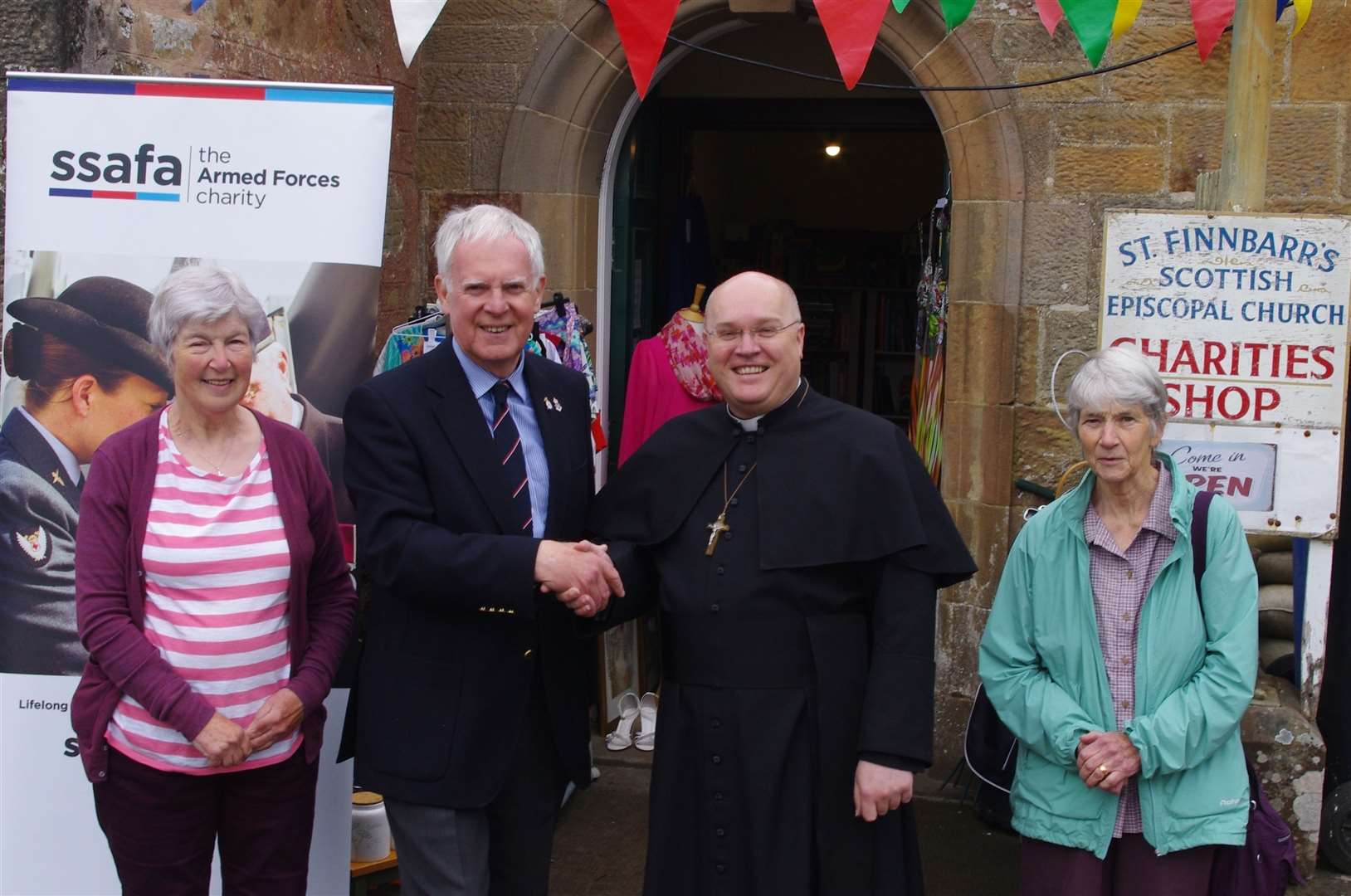 Rev Simon Scott with William Sutherland and shop staff Caroline Barnes, left, and Monica Dargie.