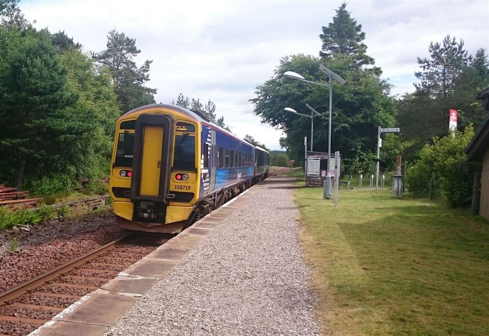 A ScotRail train pulls away from the platform at Altnabreac on the Far North Line.
