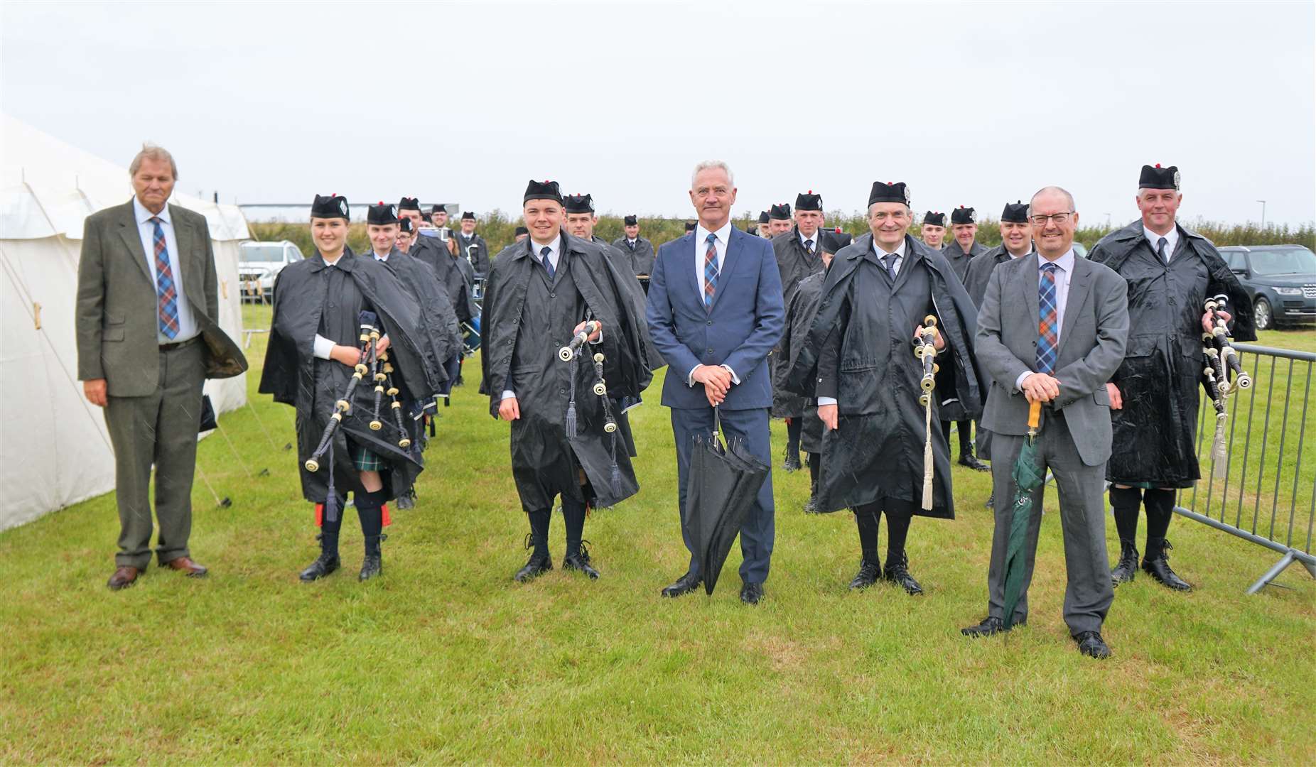 NDA/Dounreay bosses who sponsored the event with the pipe bands of Wick and Thurso. Picture: DGS