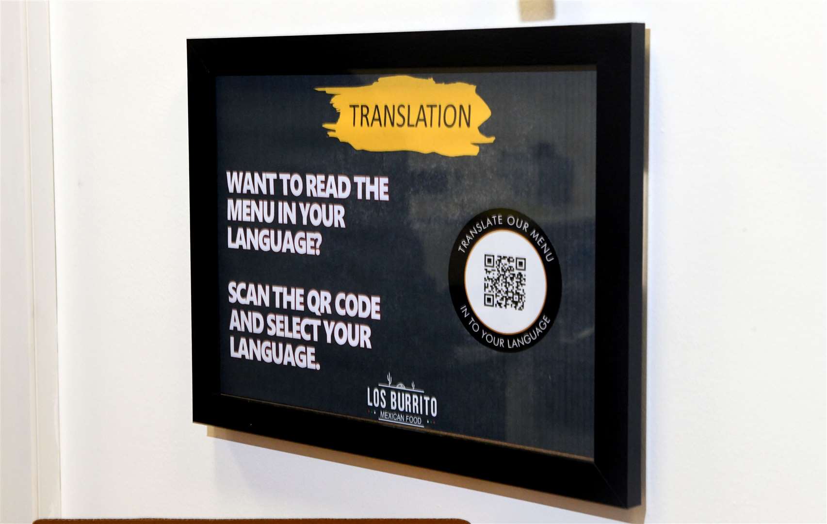 Los Burrito has a QR code on the wall for customers to scan that will translate the menu to that person's native language. Picture: James Mackenzie.