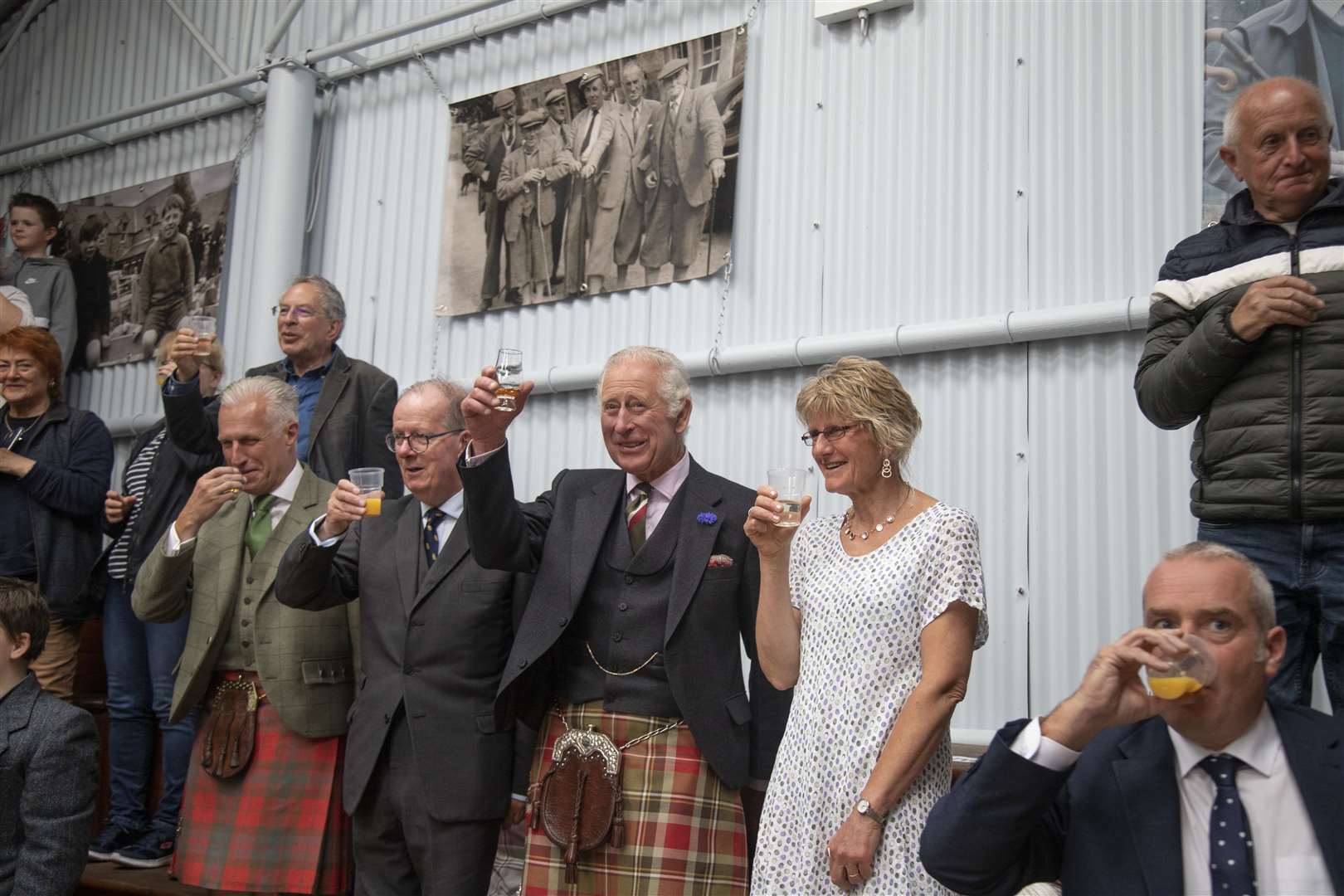 Prince Charles gives a toast to the mart, along with Lord-Lieutenant Major General Patrick Marriott and project coordinator Kate Roach. Picture: John Baikie