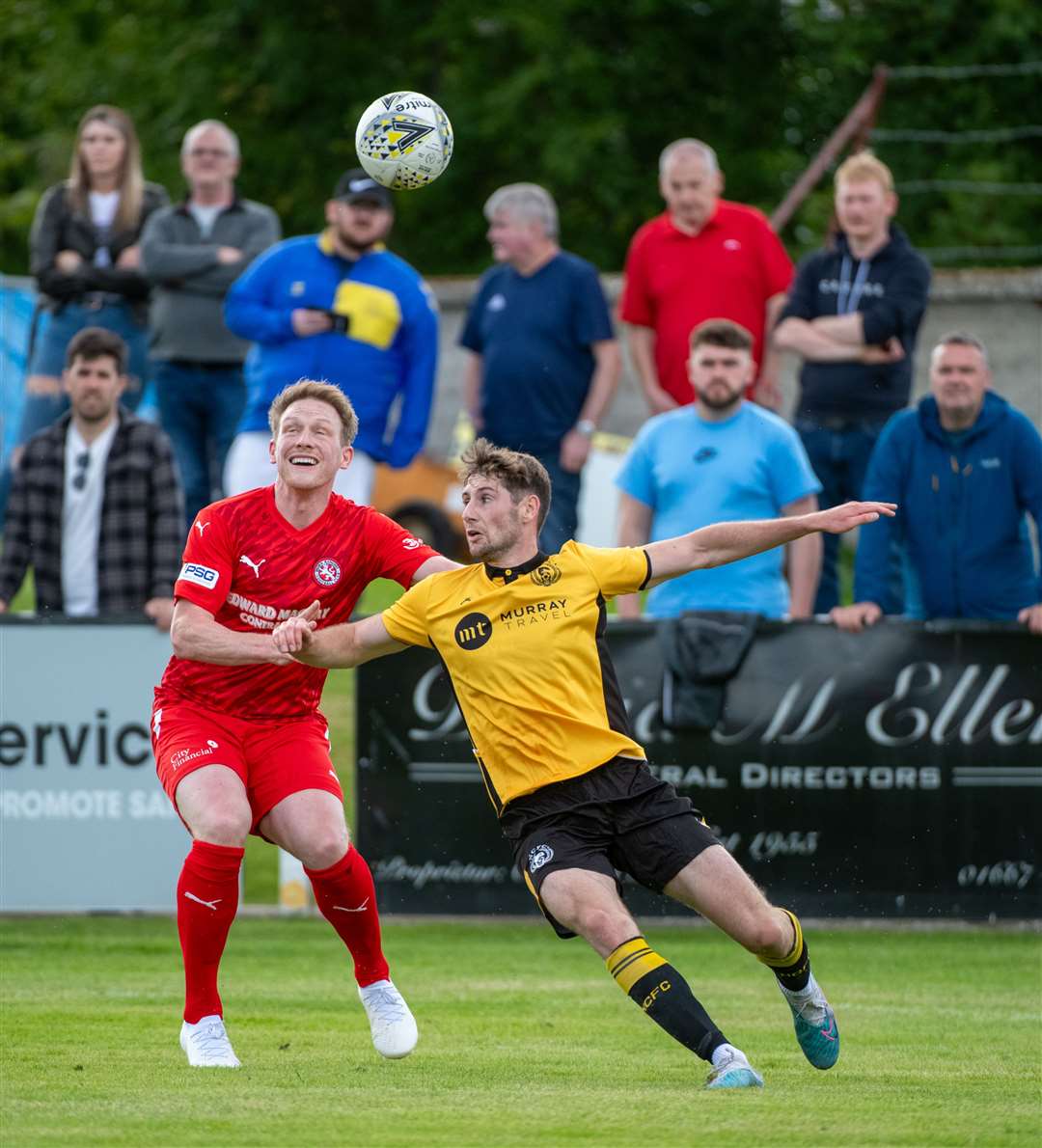 Breedon Highland Leauge. Nairn County v Brora Rangers. Brora's Ally MacDonald and Nairn's Ben Kelly. Picture: Callum Mackay..