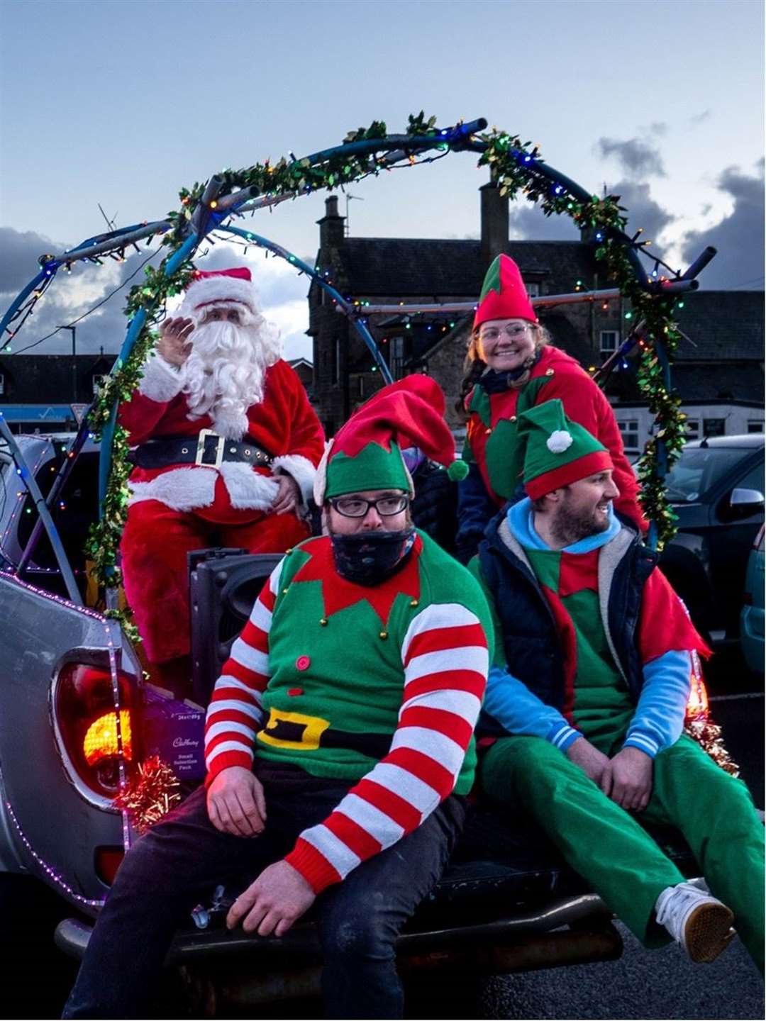 Santa rolled into the village with a squad of elves. Picture: Alan Butcher