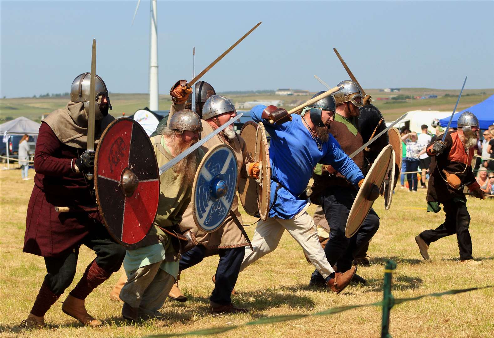 Members of the Glasgow Vikings rushing into battle on the West Clyth showfield. Picture: Alan Hendry