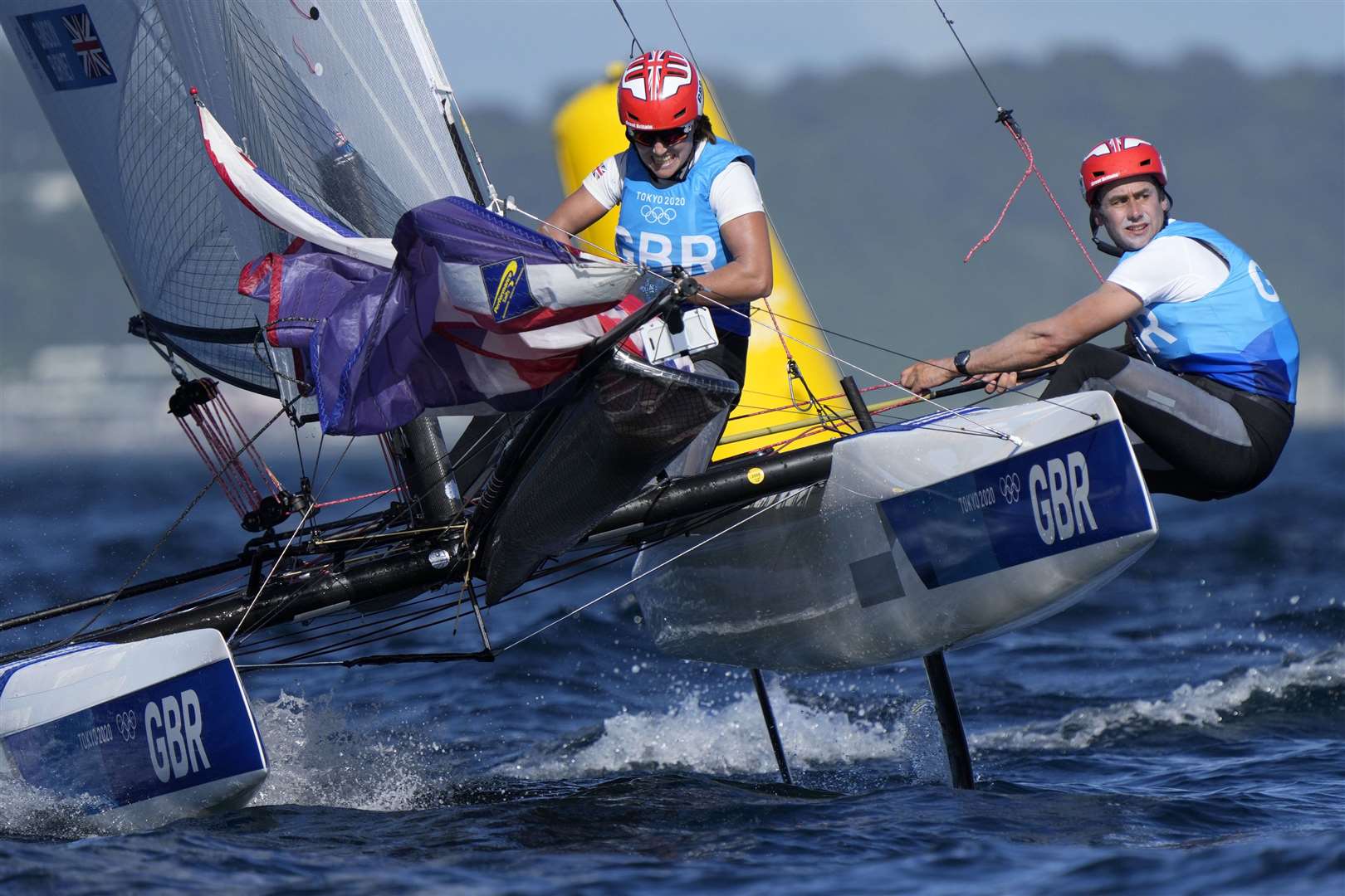 Great Britain’s Anna Burnet and John Gimson compete during the mixed Nacra 17 medal race at the 2020 (AP Photo/Bernat Armangue)
