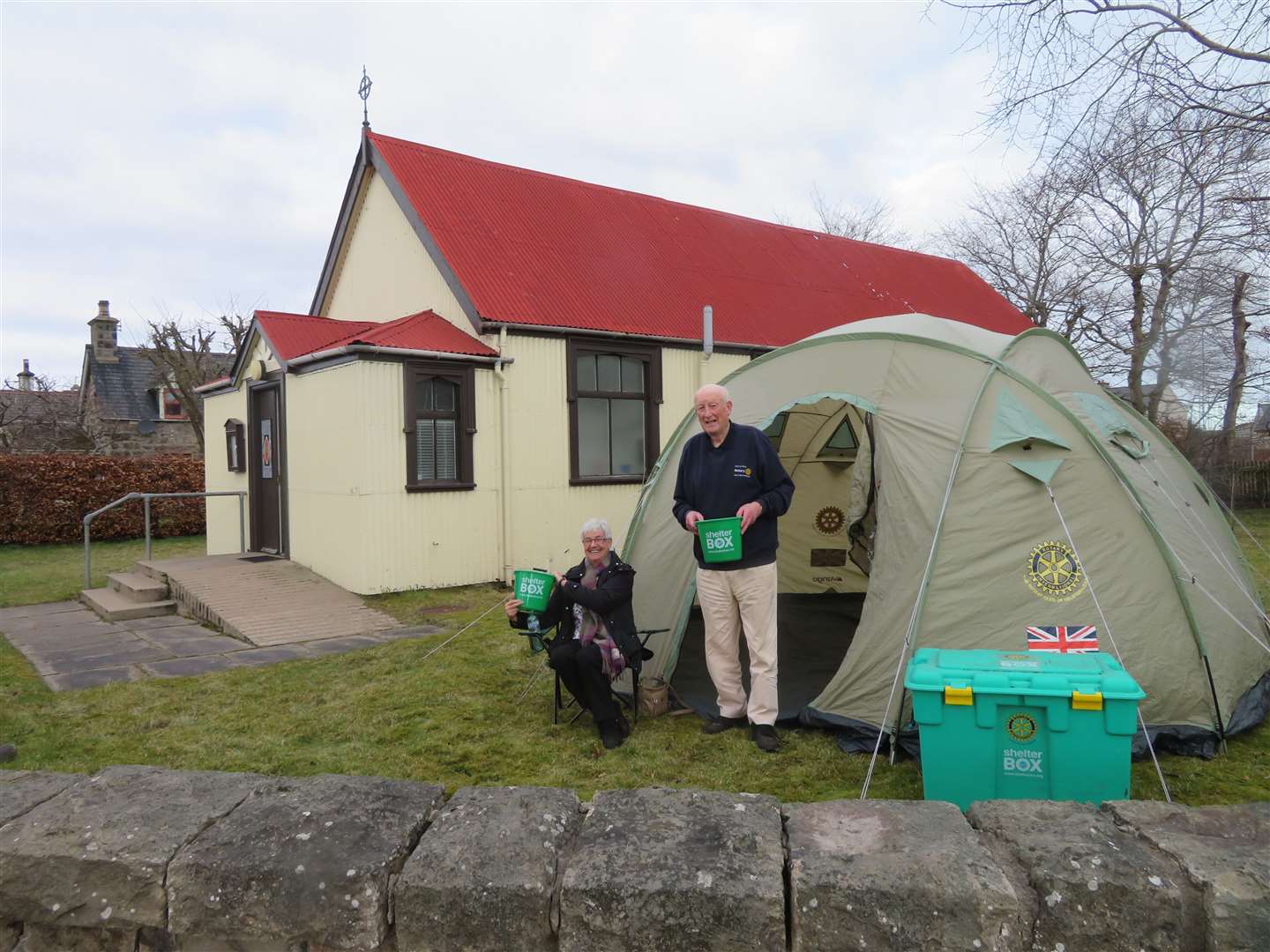 Alistair Risk is helped to pitch his tent by Rotary Club chairman Linda Graham.