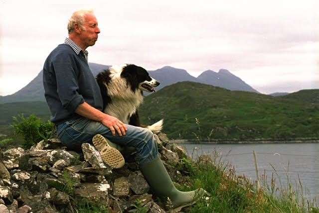 Crofter John MacKenzie, with his dog Ben, surveys the North Lochinver Estate.