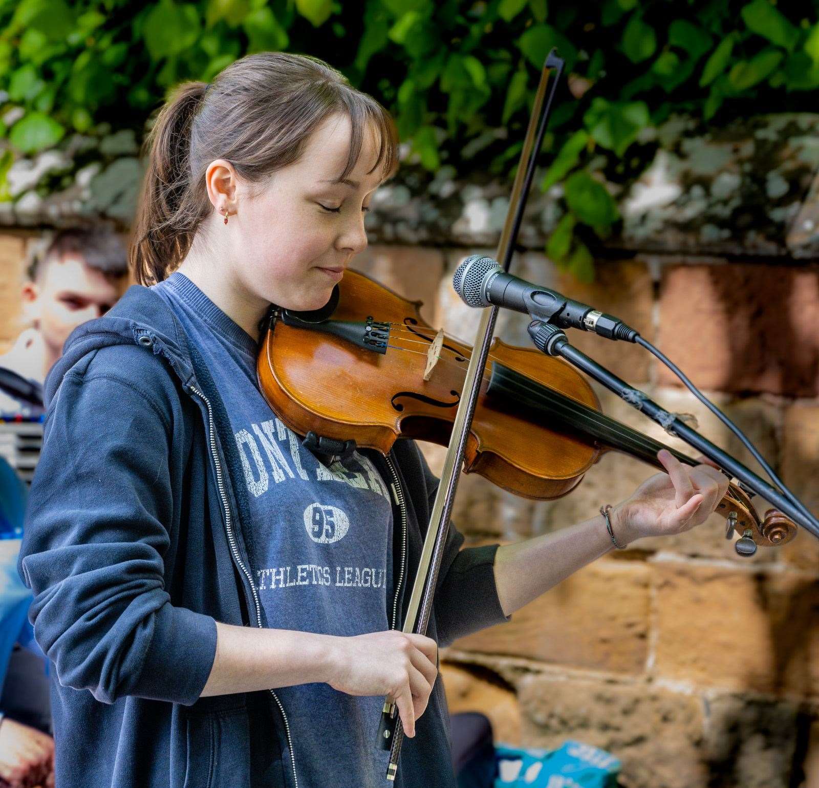 Dornoch Academy pupil Lucy Robertson plays a solo on the fiddle. Picture: Andy Kirby
