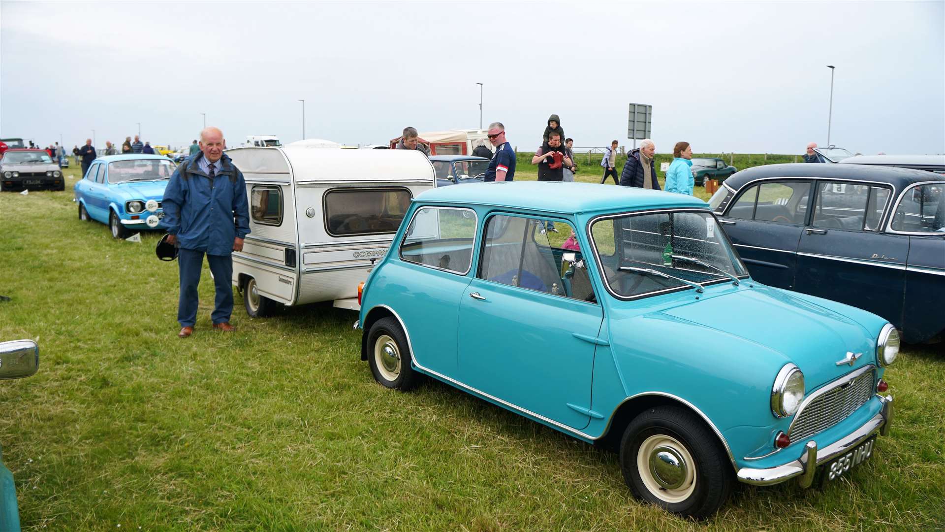 George Sutherland from Edderton with his 1961 Morris mini Saloon pulling a tiny caravan that featured at a special show at Earl's Court in the 1980s. Picture: DGS