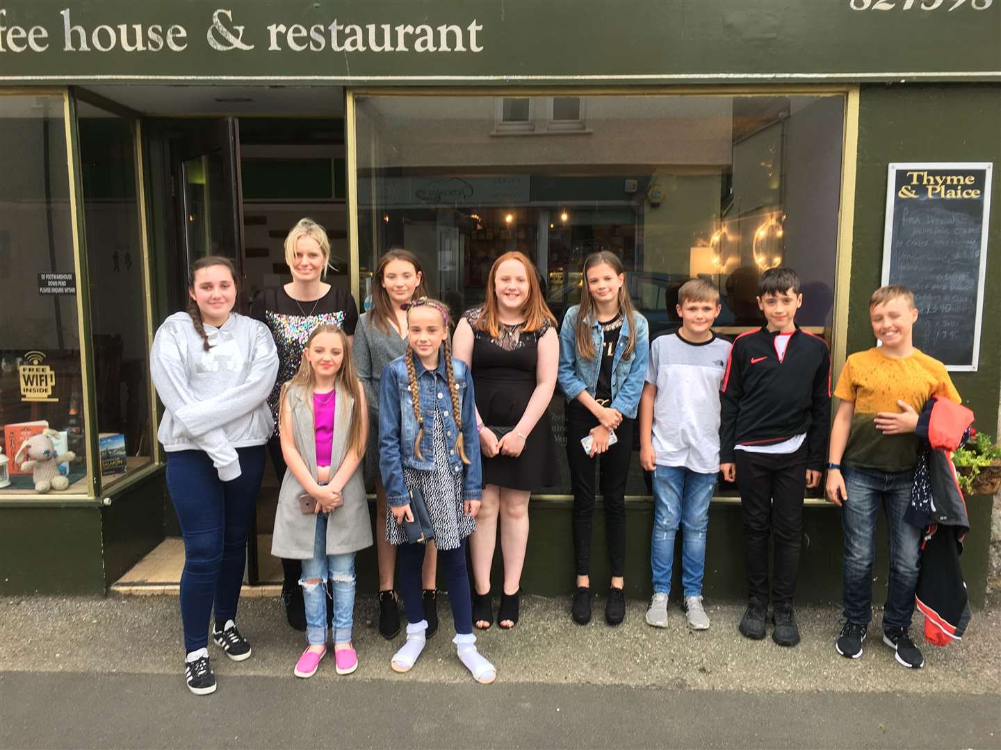 P7 children outside Thyme and Plaice restaurant where their teacher treated them to a meal.