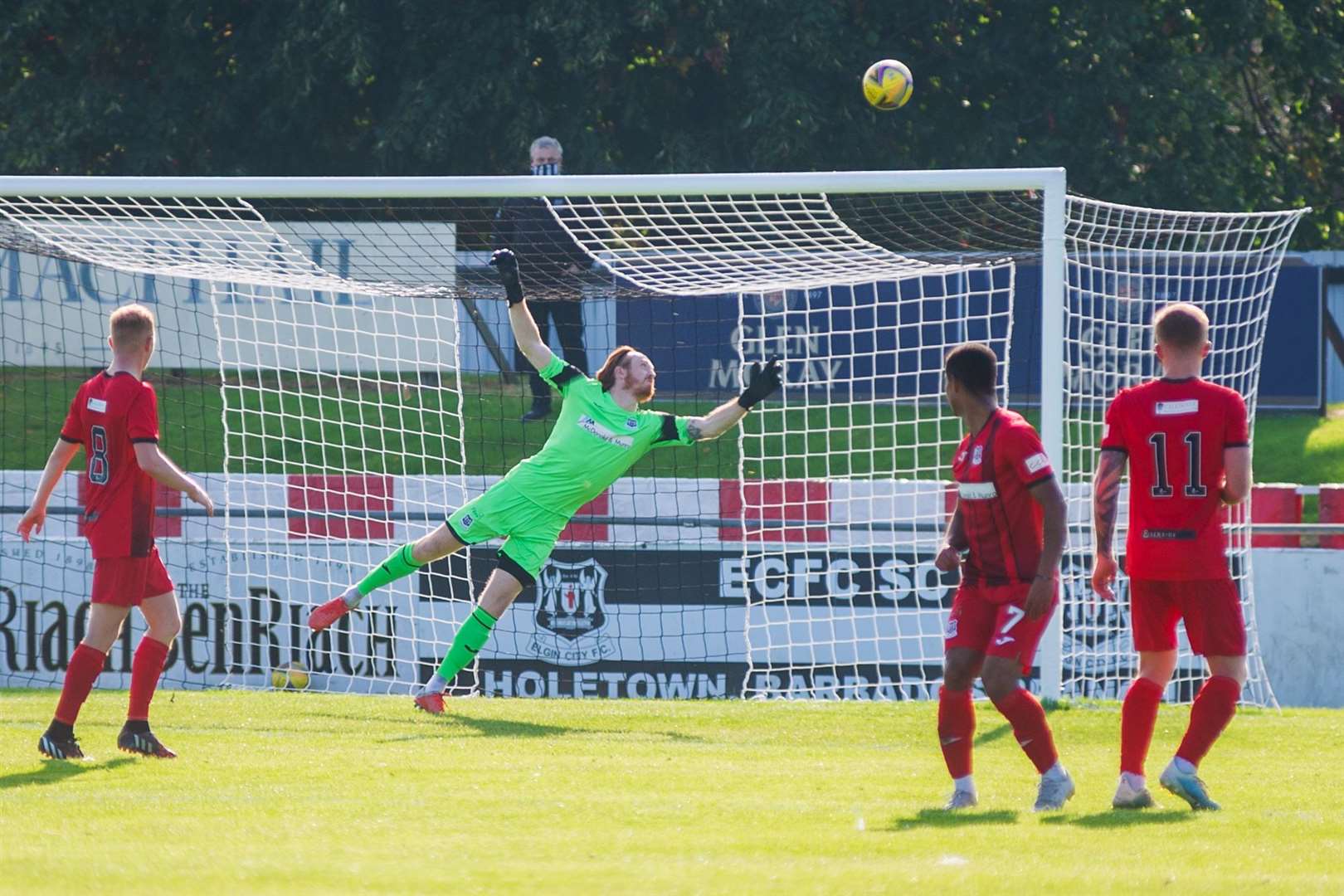 Bjorn Wagenaar's free kick beats Elgin keeper Tom McHale and hits the bar, but Greg Morrison followed up to score Brora's first goal. Picture: Daniel Forsyth..