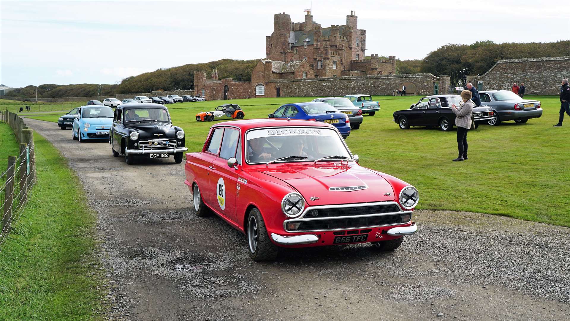 A variety of colourful vehicles leave the grounds of the castle in a steady convoy. Picture: DGS