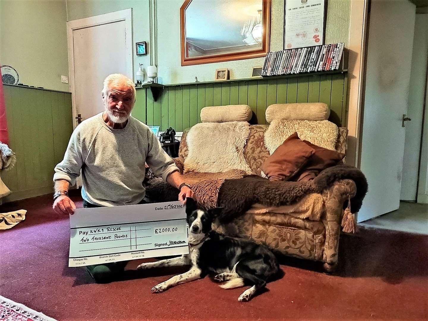 Jim Hamilton from Portgower presented a £2000 cheque to Wick-based dog rescue charity KWK9. Jim is pictured with collie dog Daisy that he got from the charity.