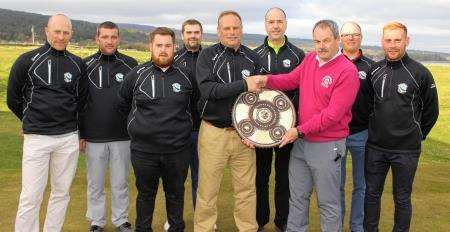 The Brora team being presented with the Dornoch Firth League Targe by Golspie captain William MacBeath left to Right – George Duncan, Dougie Thorburn Owen Maclennan, Robert MacDonald, James MacBeath, Tony Gill, William MacBeath (Golspie Captain), Roddie C