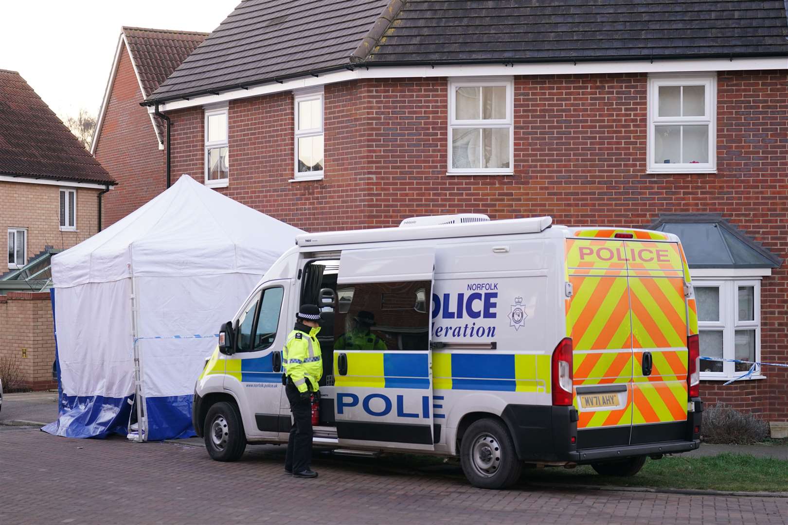 Police outside a house in Costessey near Norwich after four people were found dead inside the property(Joe Giddens/PA)