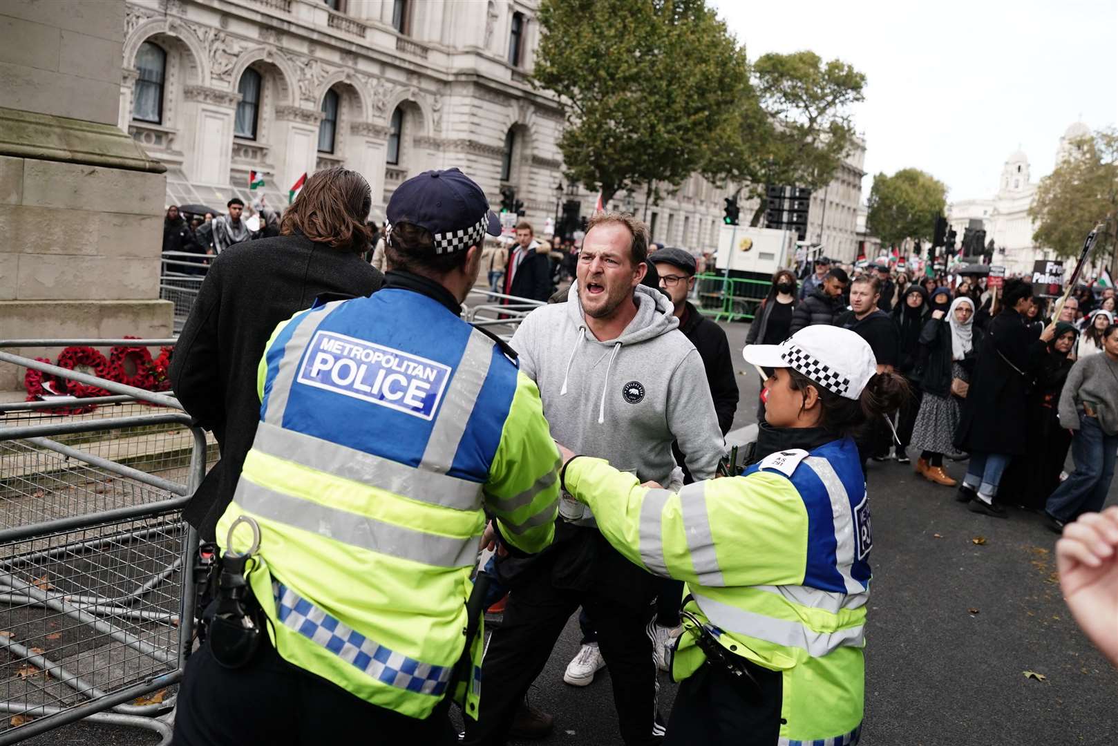 Police officers with a rival demonstration (Jordan Pettitt/PA)