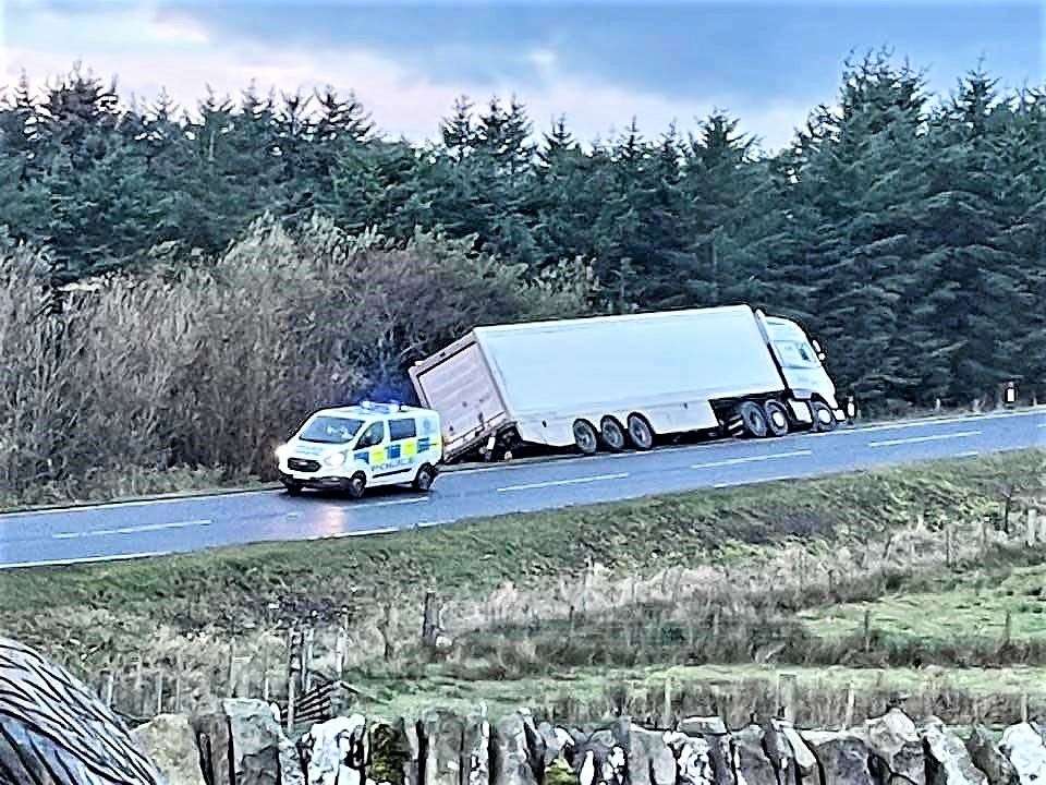 Police attend the scene after a lorry came off the A99 road at Occumster this morning. Picture: Raymond Gunn
