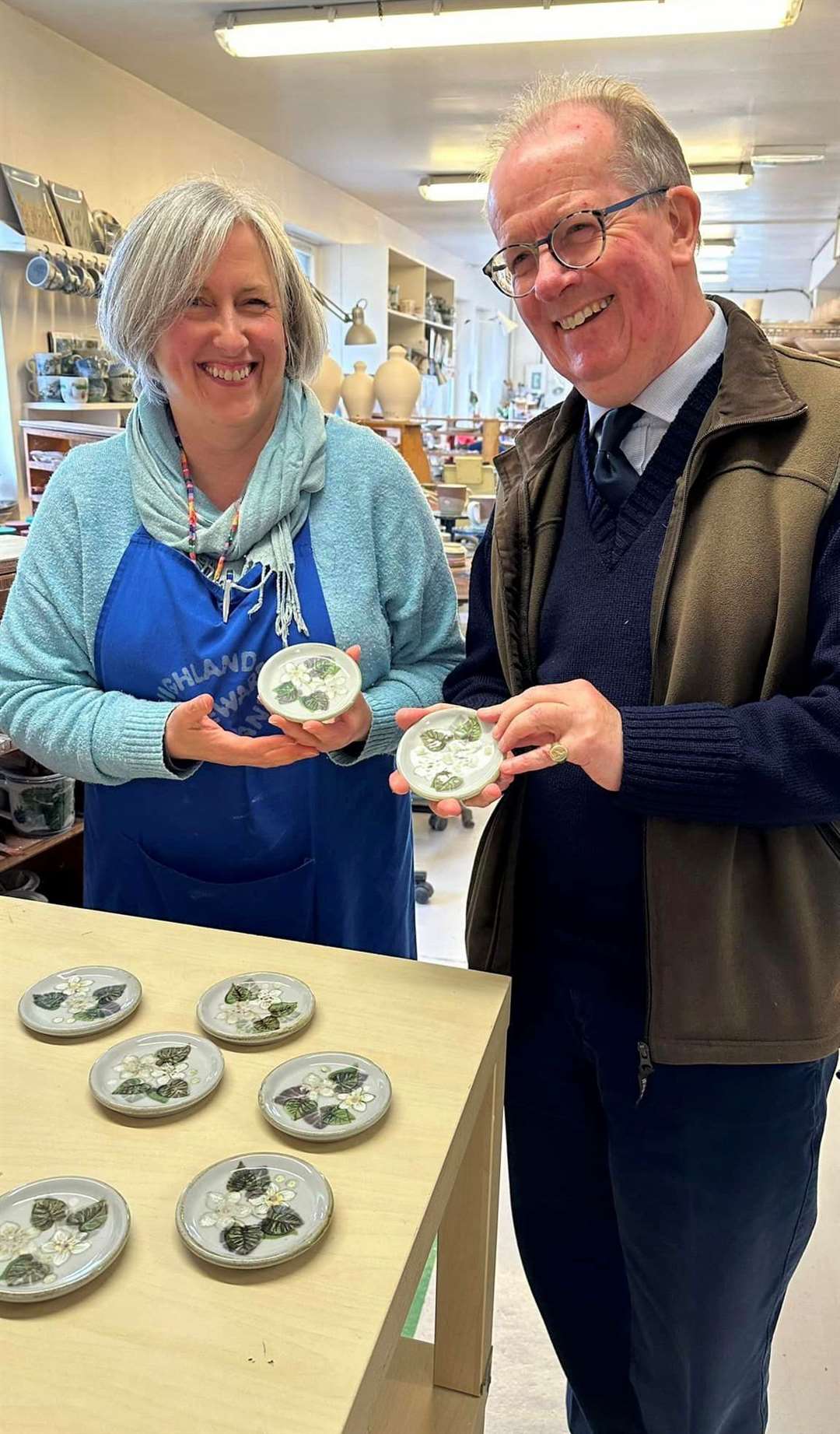 Lord Lieutenant Patrick Marriott and Tracey Aird with the specially commissioned coasters.