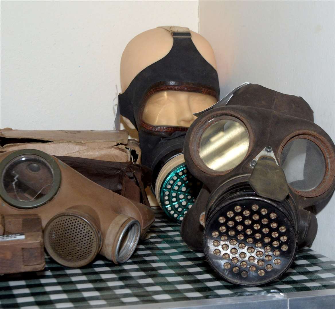 Gas masks in a reenactment of the operating room.