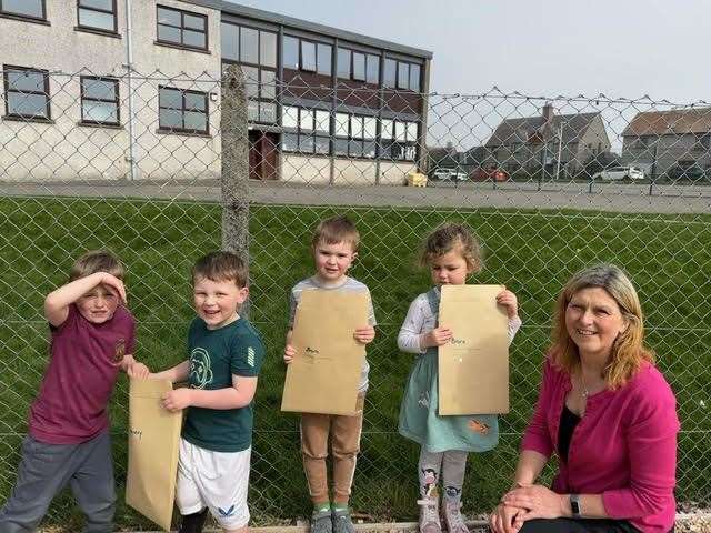 Former Brora headteacher and a deputy lieutenant, Dawn McKenzie, visited her old school to gather up pupils' drawings.