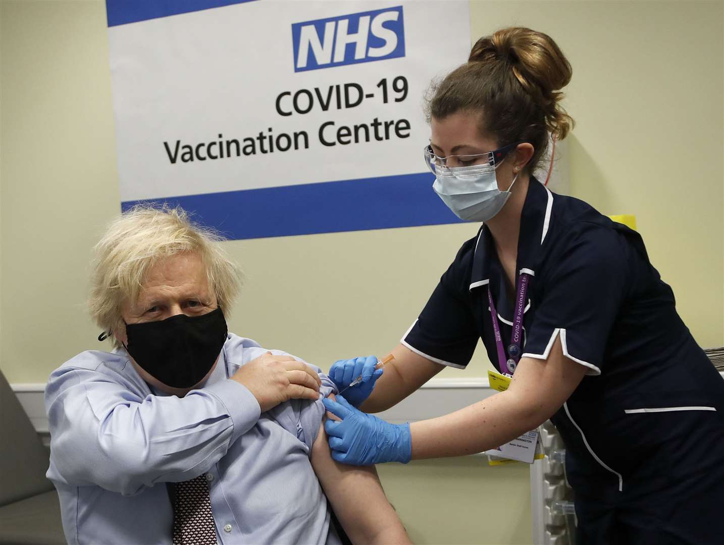 Boris Johnson getting his Covid-19 vaccine in March 2021 (Frank Augstein/PA)