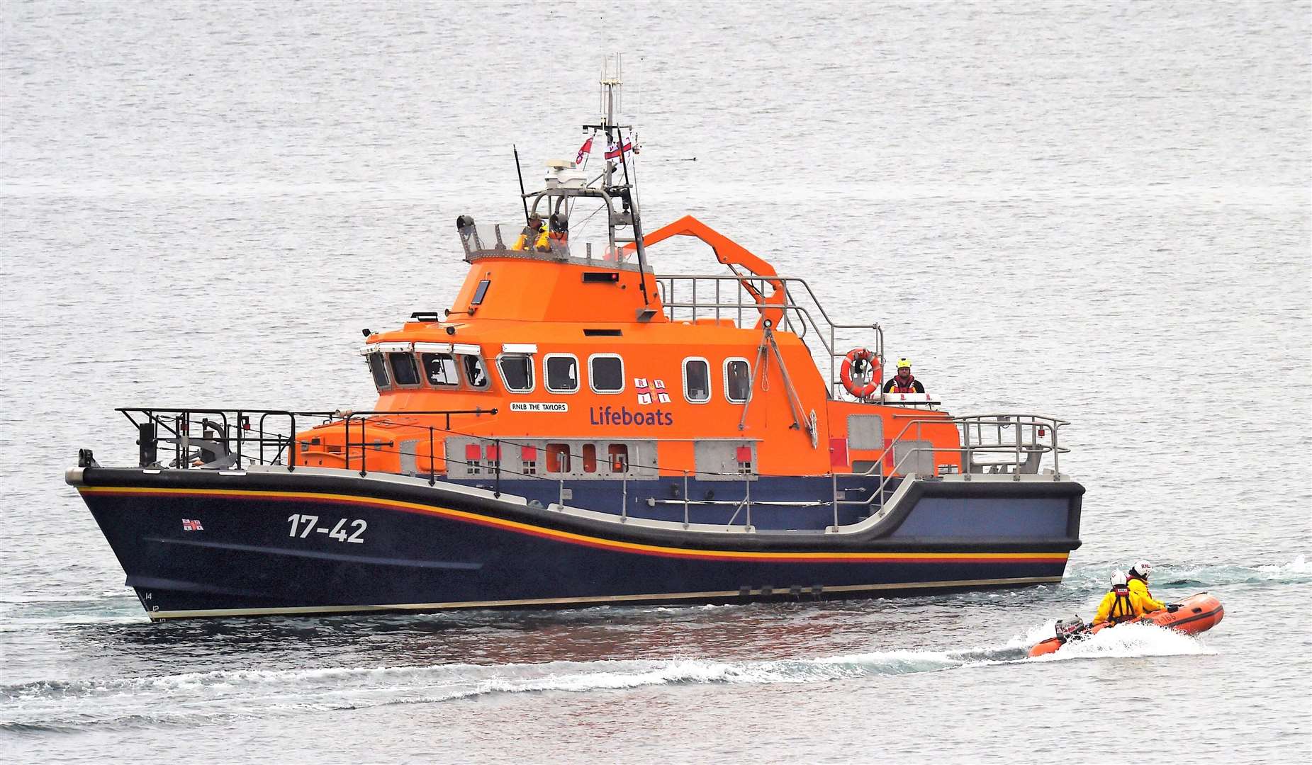 Thurso Lifeboat The Taylors and a RIB sit offshore close to the cliff. Picture: Mel Roger