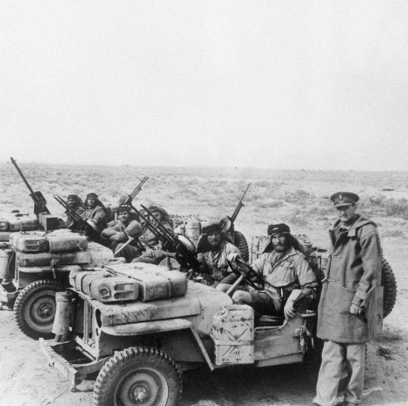 Lt. Colonel David Stirling, founder of the Special Air Service, with an SAS jeep patrol in North Africa, 18 January 1943. Closest to him is Lt Edward McDonald. Picture: No 1 Army Film & Photographic Unit, Keating G (Capt).