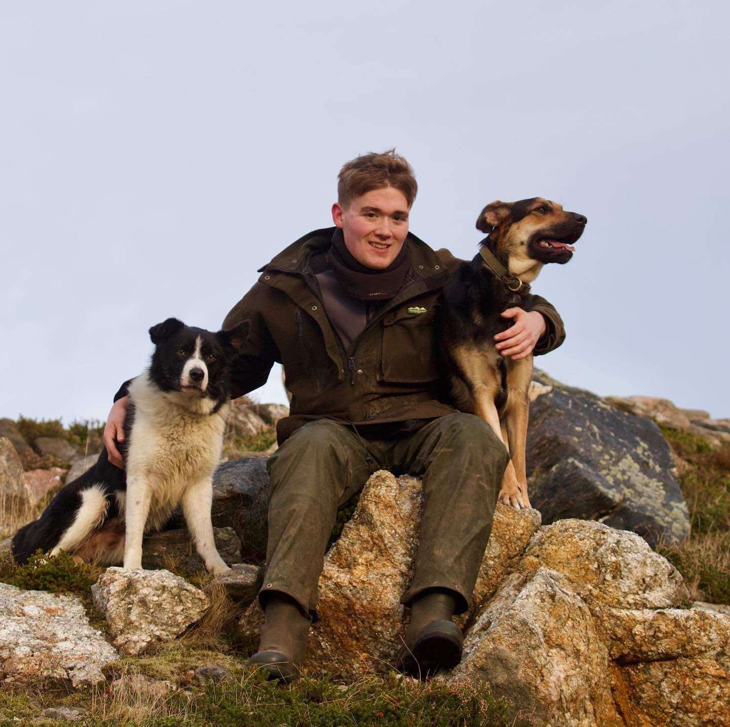 High achiever: Mure Grant at his aunt Joyce Campbell’s Armadale farm with dogs Fred and Ruby.